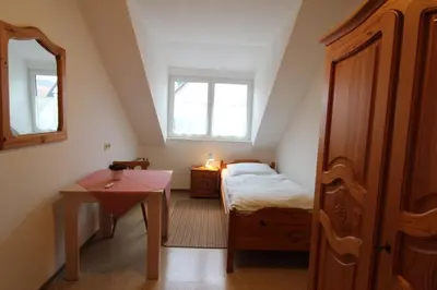 Ein Bett oder Betten in einem Zimmer der Unterkunft Gasthaus Deutsches Haus