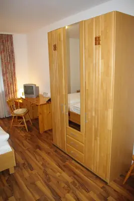 Ein Bett oder Betten in einem Zimmer der Unterkunft Hotel Garni am Hechenberg