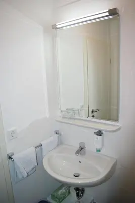 Ein Badezimmer in der Unterkunft Hotel Garni am Hechenberg