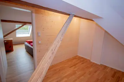 Ein Bett oder Betten in einem Zimmer der Unterkunft Historisches Wohnen modern interpretiert