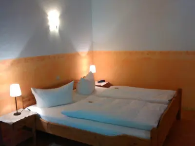 Ein Bett oder Betten in einem Zimmer der Unterkunft Zur Mühle