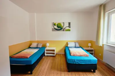 Ein Bett oder Betten in einem Zimmer der Unterkunft Ferienhaus Sommerweide 160qm bis 10P