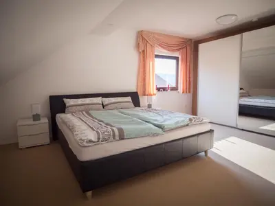 Ein Bett oder Betten in einem Zimmer der Unterkunft Ferienwohnung Mömlingtal