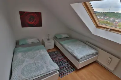 Ein Bett oder Betten in einem Zimmer der Unterkunft Ferienwohnung Mömlingtal