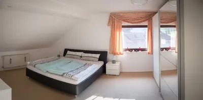Ein Bett oder Betten in einem Zimmer der Unterkunft Ferienwohnung Mömlingtal