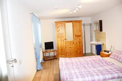 Ein Bett oder Betten in einem Zimmer der Unterkunft Ferienhaus Modautaler Sonnenhang