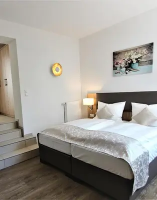 Ein Bett oder Betten in einem Zimmer der Unterkunft Hotel Adler