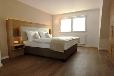 Ein Bett oder Betten in einem Zimmer der Unterkunft Hotel Adler