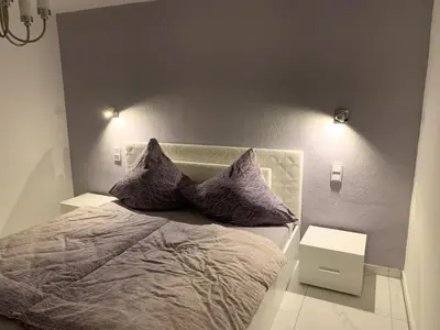 Ein Bett oder Betten in einem Zimmer der Unterkunft Moderne 2 Zimmer Wohnung mit Vollausstattung