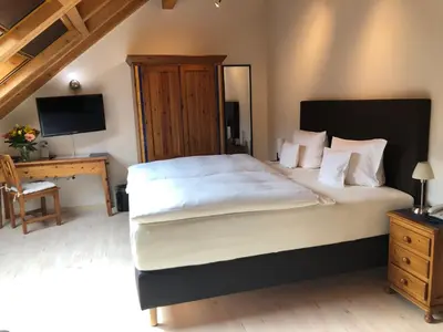 Ein Bett oder Betten in einem Zimmer der Unterkunft Gästehaus & Weingut PETH