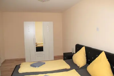 Ein Bett oder Betten in einem Zimmer der Unterkunft Ferienwohnung bei Heidelberg