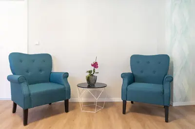 Ein Sitzbereich in der Unterkunft Hotel Phoenix