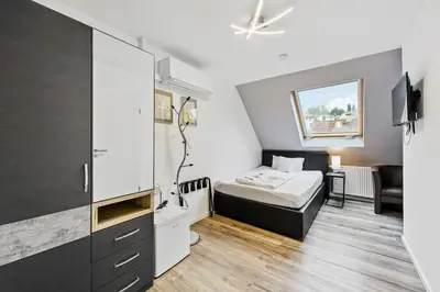 Ein Bett oder Betten in einem Zimmer der Unterkunft Hotel Phoenix