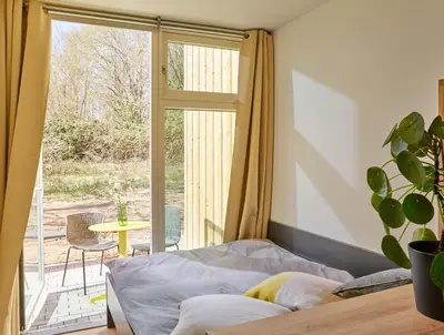 Ein Bett oder Betten in einem Zimmer der Unterkunft Modern ausgebauter Überseecontainer als Tiny House