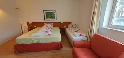 Ein Bett oder Betten in einem Zimmer der Unterkunft Flörsheimer Hof