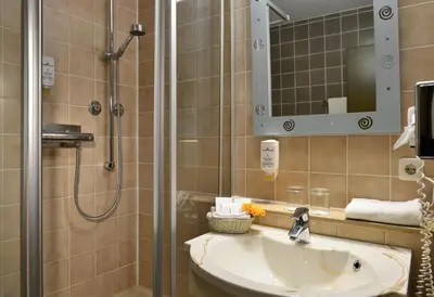 Ein Badezimmer in der Unterkunft PLAZA INN Leonberg