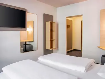 Ein Bett oder Betten in einem Zimmer der Unterkunft B&B HOTEL Mannheim-City
