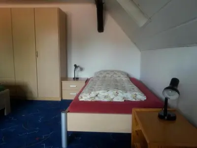 Ein Bett oder Betten in einem Zimmer der Unterkunft Ferienwohnungen Faber