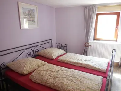 Ein Bett oder Betten in einem Zimmer der Unterkunft Ferienwohnungen Faber