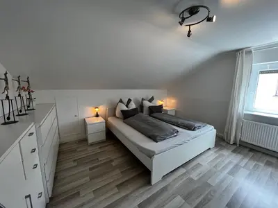 Ein Bett oder Betten in einem Zimmer der Unterkunft Ferienwohnung Schlüter Nußloch