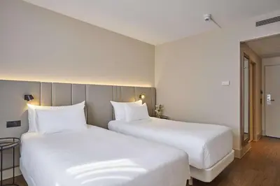 Ein Bett oder Betten in einem Zimmer der Unterkunft NH Frankfurt Airport