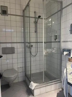 Ein Badezimmer in der Unterkunft Astralis Hotel Domizil