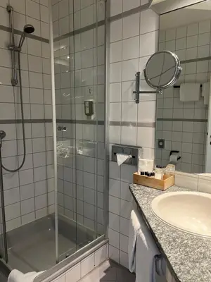 Ein Badezimmer in der Unterkunft Astralis Hotel Domizil