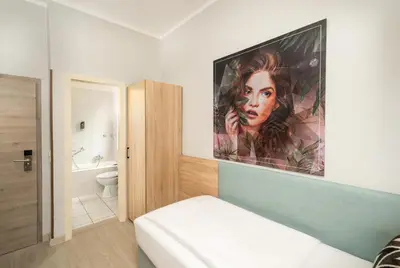Ein Bett oder Betten in einem Zimmer der Unterkunft ANA Eden Karlsruhe, Trademark Collection by Wyndham