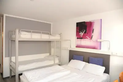 Ein Bett oder Betten in einem Zimmer der Unterkunft hogh Hotel Heilbronn