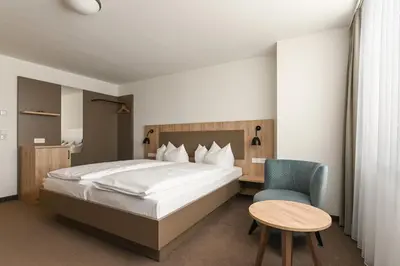 Ein Bett oder Betten in einem Zimmer der Unterkunft Landschloss Korntal