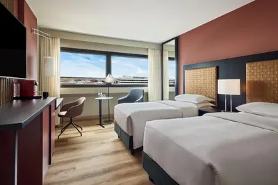 Ein Bett oder Betten in einem Zimmer der Unterkunft Sheraton Frankfurt Airport Hotel & Conference Center