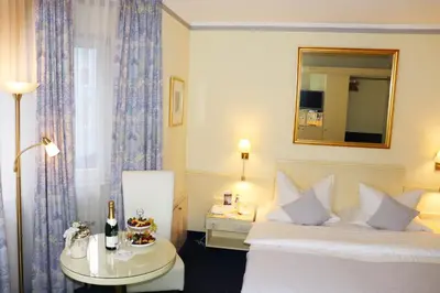 Ein Bett oder Betten in einem Zimmer der Unterkunft Hotel Dalberg