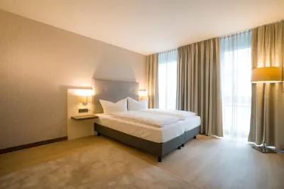 Ein Bett oder Betten in einem Zimmer der Unterkunft Heidelberg Hospitality Boarding House