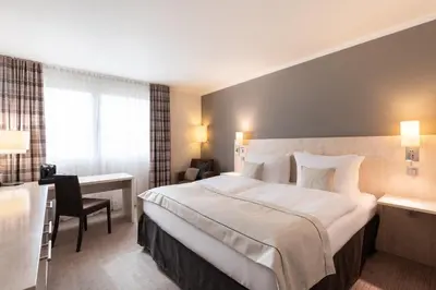 Ein Bett oder Betten in einem Zimmer der Unterkunft Garner Hotel Mainz by IHG