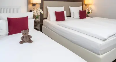 Ein Bett oder Betten in einem Zimmer der Unterkunft PLAZA INN Karlsruhe Nord