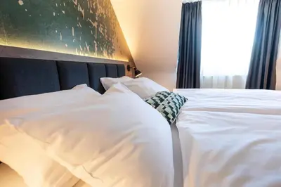 Ein Bett oder Betten in einem Zimmer der Unterkunft ACHAT Hotel Schwetzingen Heidelberg