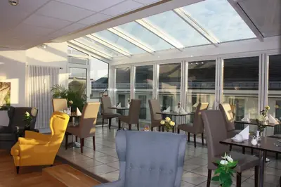Ein Sitzbereich in der Unterkunft Hotel Am Markt