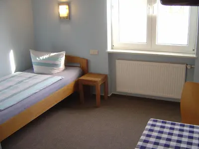 Ein Bett oder Betten in einem Zimmer der Unterkunft Hotel Garni Pension Ruth