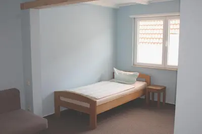 Ein Bett oder Betten in einem Zimmer der Unterkunft Hotel Garni Pension Ruth
