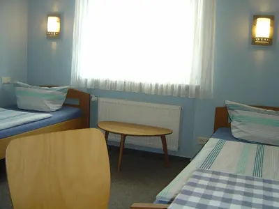 Ein Bett oder Betten in einem Zimmer der Unterkunft Hotel Garni Pension Ruth