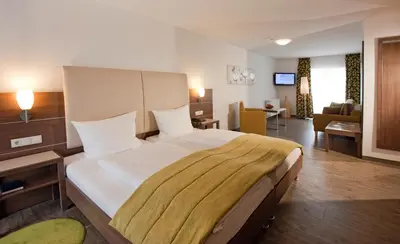 Ein Bett oder Betten in einem Zimmer der Unterkunft Hotel-Restaurant Pfälzer Hof