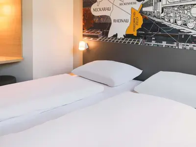 Ein Bett oder Betten in einem Zimmer der Unterkunft B&B Hotel Mannheim-Friedrichsfeld