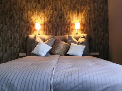 Ein Bett oder Betten in einem Zimmer der Unterkunft Villa Kopp-Das Gästehaus