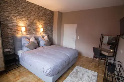 Ein Bett oder Betten in einem Zimmer der Unterkunft Villa Kopp-Das Gästehaus