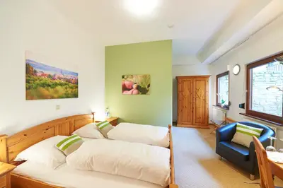 Ein Bett oder Betten in einem Zimmer der Unterkunft Gästehaus Achenbach