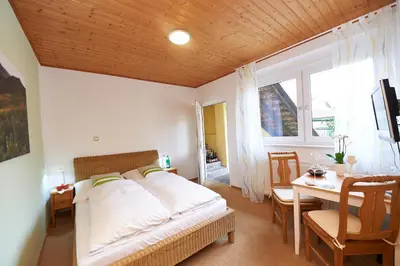 Ein Bett oder Betten in einem Zimmer der Unterkunft Gästehaus Achenbach