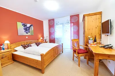 Ein Bett oder Betten in einem Zimmer der Unterkunft Gästehaus Achenbach