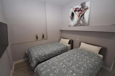 Ein Bett oder Betten in einem Zimmer der Unterkunft Connie's Apartments