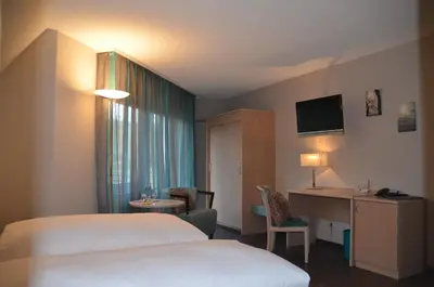 Ein Bett oder Betten in einem Zimmer der Unterkunft Castell Hotel & Restaurant