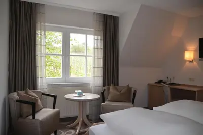 Ein Bett oder Betten in einem Zimmer der Unterkunft Castell Hotel & Restaurant